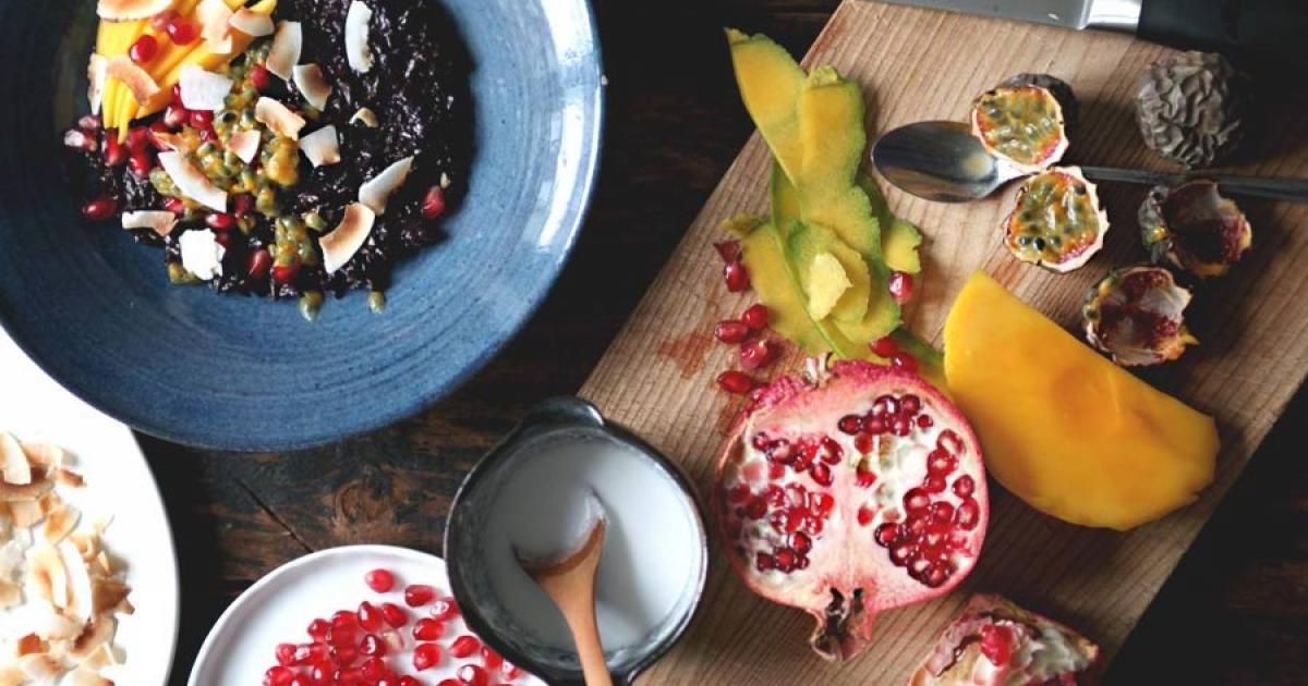 black sticky rice breakfast porridge with mango pomegranate coconut